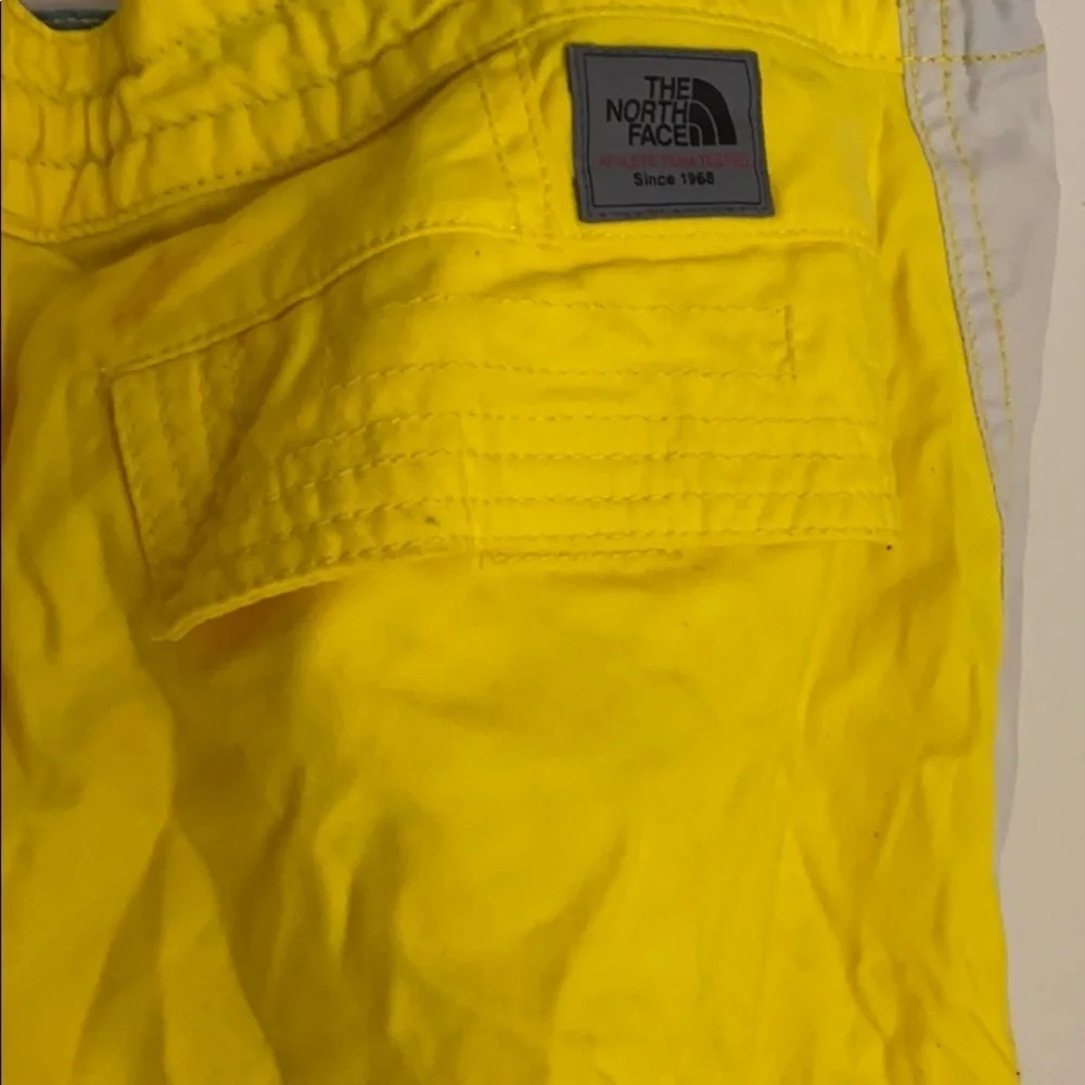 The north face men’s yellow swimming trunks